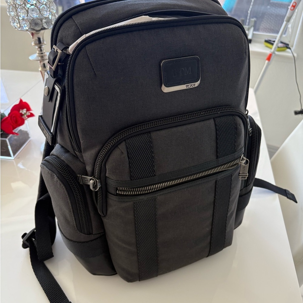 Tumi Black Backpack with Durable Nylon and Padded Straps